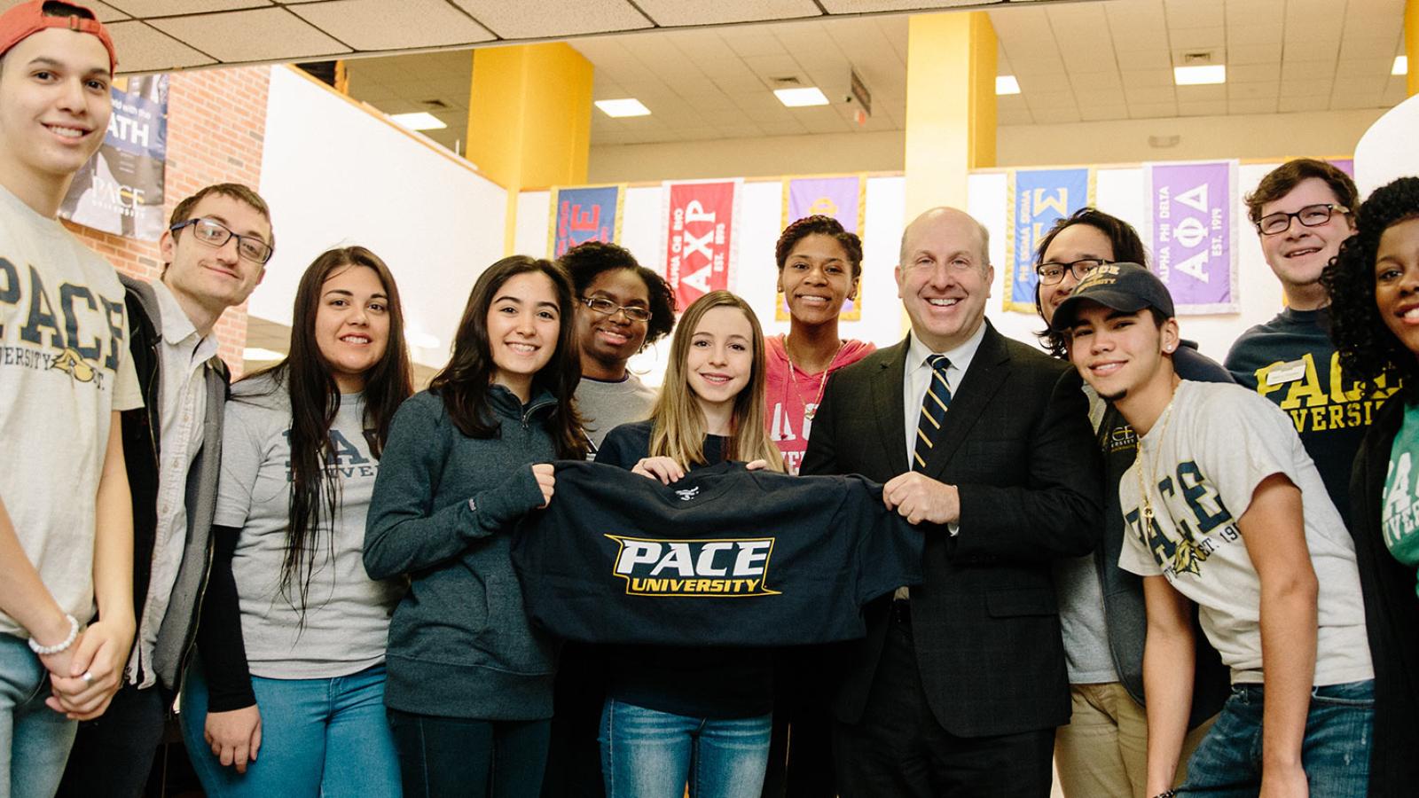  President, Marvin Krislov with students in the Kessel Student center