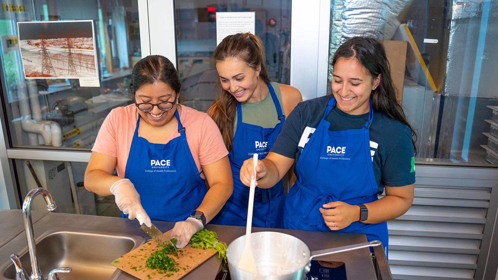 Students cooking at the Nutrition and Dietetics Teaching Kitchen at .