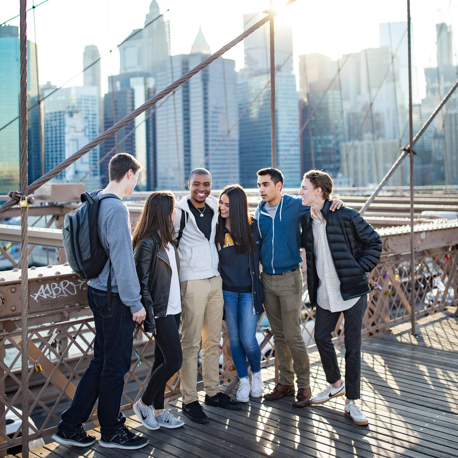  students standing on the Brooklyn Bridge